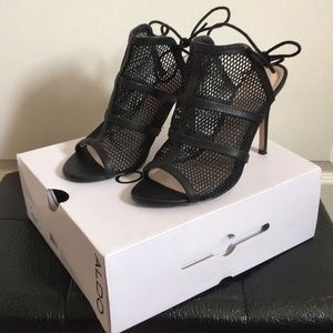 Caged black heels with ankle laces